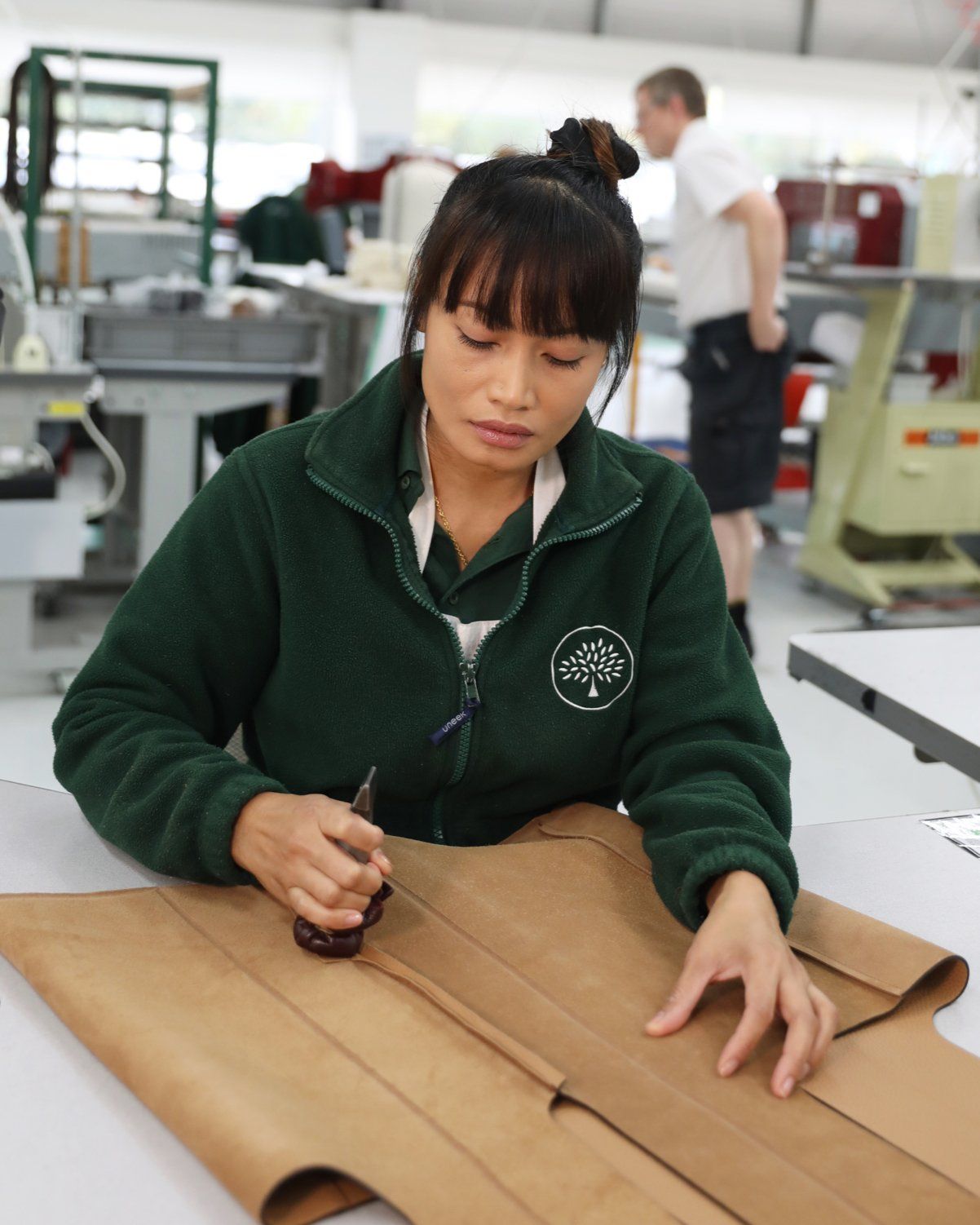 Mulberry employee stitching in the factory